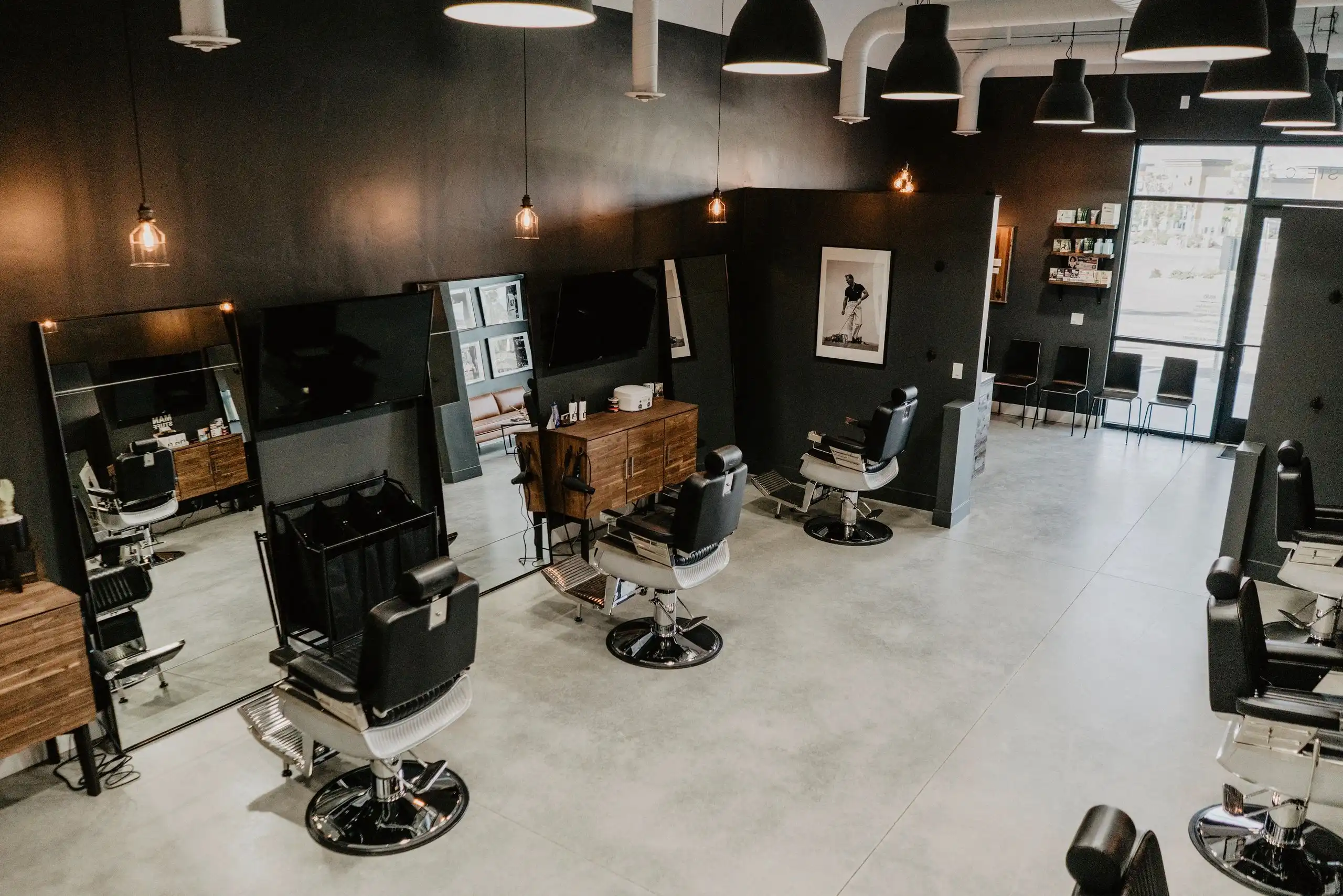 Barber stations inside a G.O.A.T. Haircuts shop